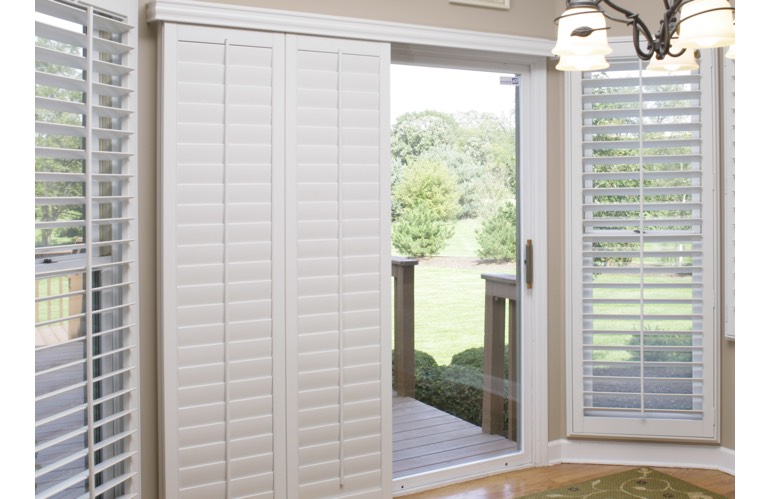 Sliding door with shutters leading out to patio